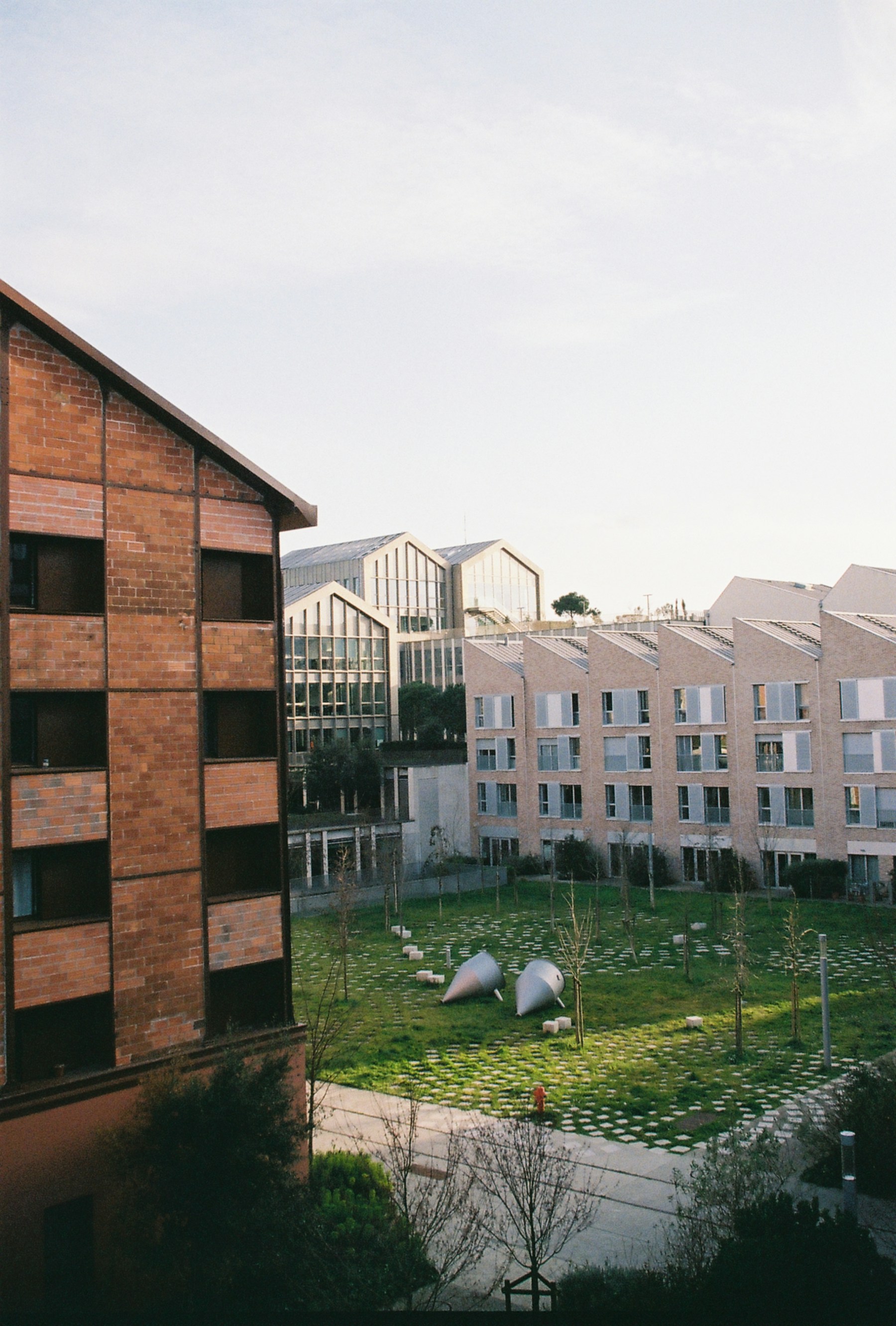 Modern neighbourhood courtyard as a calm closing image for the Close website